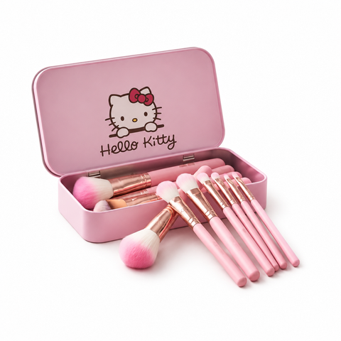 Pink makeup brushes with open Hello Kitty-themed pink storage tin on white background
