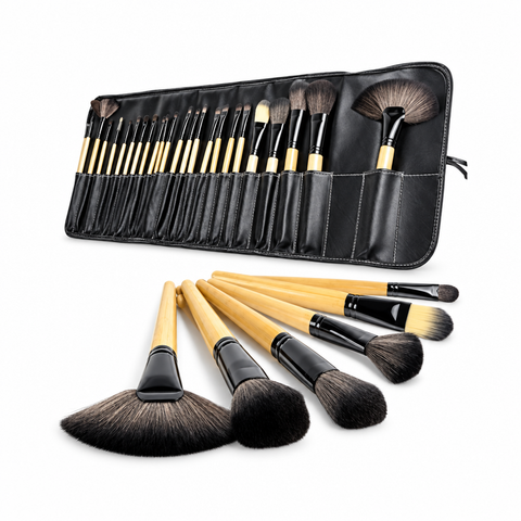 Makeup brush set with gold-tone handles and black storage case on a white background