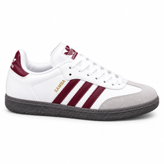 White and burgundy ladies’ Samba-style sneaker on white background