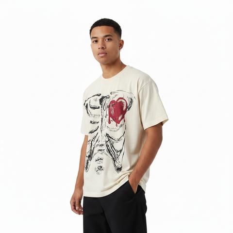 Stylish male model wearing a cream T-shirt with ribcage and red melted-heart graphic