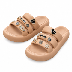 Tan-coloured Love slides with decorative charms