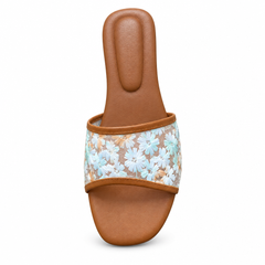 Tan floral flat slipper on white background