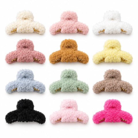 Assorted fluffy hair claw clips on a clean white background