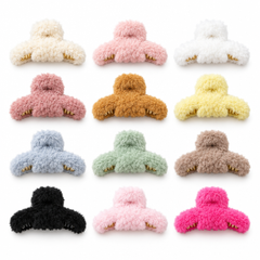 Assorted fluffy hair claw clips on a clean white background