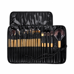Makeup brushes in an open black storage case on a clean white background