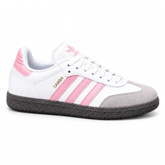 White and pink ladies’ Samba-style sneaker on white background