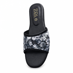 Black floral flat slipper on white background