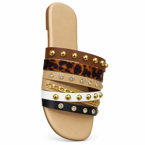 Studded sandal detail on a white background